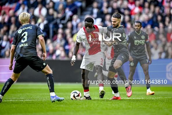 AFC Ajax Amsterdam forward Brian Brobbey and FC Groningen defender Marco Rente play during the match between Ajax and Groningen at the Johan...