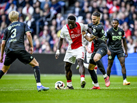 AFC Ajax Amsterdam forward Brian Brobbey and FC Groningen defender Marco Rente play during the match between Ajax and Groningen at the Johan...