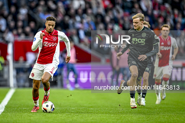 AFC Ajax Amsterdam forward Chuba Akpom and FC Groningen midfielder Jorg Schreuders play during the match between Ajax and Groningen at the J...