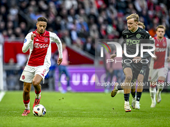 AFC Ajax Amsterdam forward Chuba Akpom and FC Groningen midfielder Jorg Schreuders play during the match between Ajax and Groningen at the J...