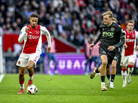 AFC Ajax Amsterdam forward Chuba Akpom and FC Groningen midfielder Jorg Schreuders play during the match between Ajax and Groningen at the J...