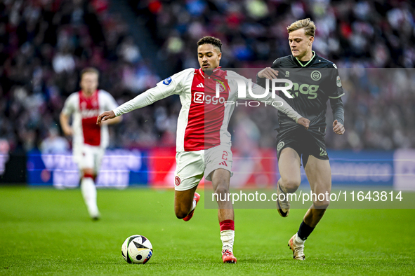 AFC Ajax Amsterdam defender Devyne Rensch and FC Groningen defender Finn Stam play during the match between Ajax and Groningen at the Johan...