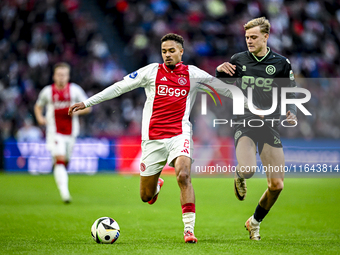 AFC Ajax Amsterdam defender Devyne Rensch and FC Groningen defender Finn Stam play during the match between Ajax and Groningen at the Johan...