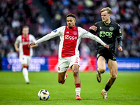 AFC Ajax Amsterdam defender Devyne Rensch and FC Groningen defender Finn Stam play during the match between Ajax and Groningen at the Johan...