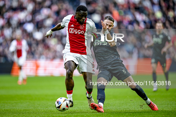 AFC Ajax Amsterdam forward Brian Brobbey and FC Groningen defender Marco Rente play during the match between Ajax and Groningen at the Johan...