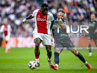 AFC Ajax Amsterdam forward Brian Brobbey and FC Groningen defender Marco Rente play during the match between Ajax and Groningen at the Johan...