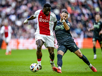 AFC Ajax Amsterdam forward Brian Brobbey and FC Groningen defender Marco Rente play during the match between Ajax and Groningen at the Johan...