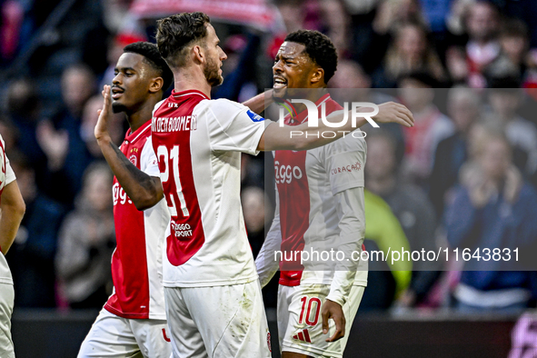 AFC Ajax Amsterdam midfielder Branco van den Boomen and AFC Ajax Amsterdam forward Chuba Akpom celebrate the 3-1 goal during the match betwe...