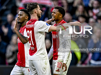 AFC Ajax Amsterdam midfielder Branco van den Boomen and AFC Ajax Amsterdam forward Chuba Akpom celebrate the 3-1 goal during the match betwe...