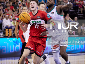 Agustin Ubal of Coviran Granada competes for the ball with Melvin Ejim of Unicaja Malaga during the Liga Endesa ACB league basketball match...