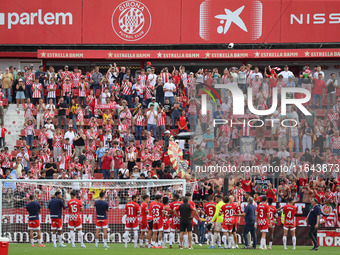 Girona players celebrate victory with their supporters at the end of the match between Girona FC and Athletic Club, corresponding to week 9...