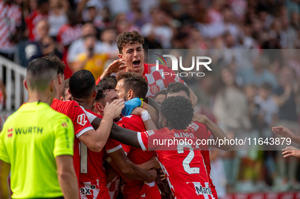 In Girona, Spain, on October 6, 2024, Girona FC players celebrate after scoring a goal during the LaLiga EA Sports match between Girona FC a...