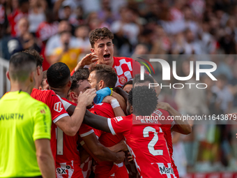 In Girona, Spain, on October 6, 2024, Girona FC players celebrate after scoring a goal during the LaLiga EA Sports match between Girona FC a...