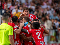 In Girona, Spain, on October 6, 2024, Girona FC players celebrate after scoring a goal during the LaLiga EA Sports match between Girona FC a...