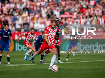 Cristhian Stuani of Girona FC is in action during the LaLiga EA Sports match between Girona FC and Athletic Club de Bilbao at Montilivi Stad...