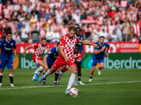 Cristhian Stuani of Girona FC is in action during the LaLiga EA Sports match between Girona FC and Athletic Club de Bilbao at Montilivi Stad...