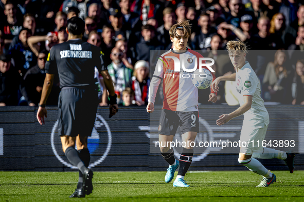 Feyenoord Rotterdam forward Ayase Ueda and FC Twente defender Max Bruns play during the match between Feyenoord and Twente at the Feyenoord...