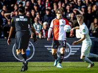 Feyenoord Rotterdam forward Ayase Ueda and FC Twente defender Max Bruns play during the match between Feyenoord and Twente at the Feyenoord...