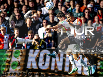 Feyenoord Rotterdam forward Igor Paixao and FC Twente defender Bas Kuipers play during the match between Feyenoord and Twente at the Feyenoo...