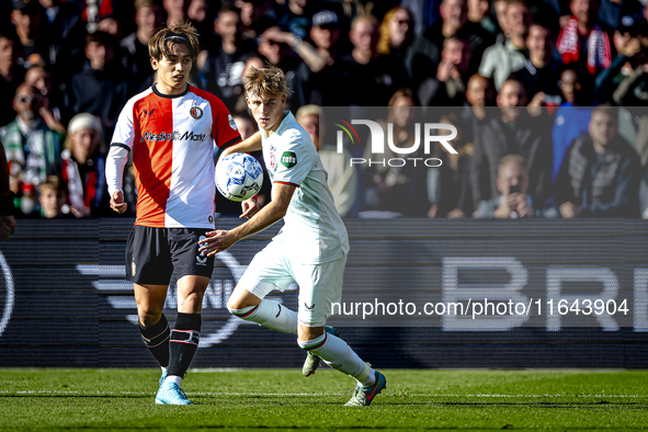 Feyenoord Rotterdam forward Ayase Ueda and FC Twente defender Max Bruns play during the match between Feyenoord and Twente at the Feyenoord...