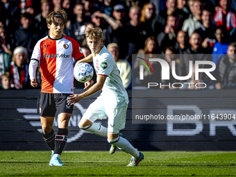 Feyenoord Rotterdam forward Ayase Ueda and FC Twente defender Max Bruns play during the match between Feyenoord and Twente at the Feyenoord...