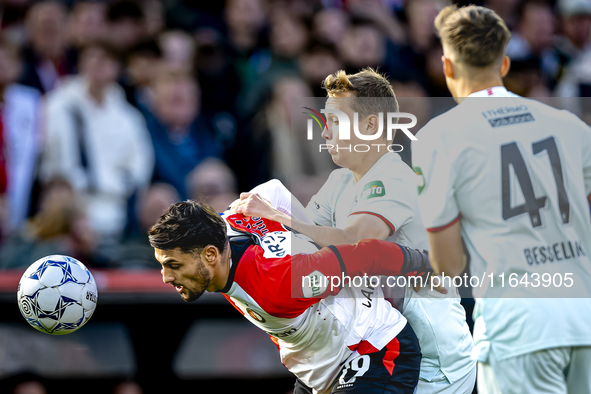 Feyenoord Rotterdam forward Santiago Gimenez and FC Twente midfielder Mathias Kjolo play during the match between Feyenoord and Twente at th...