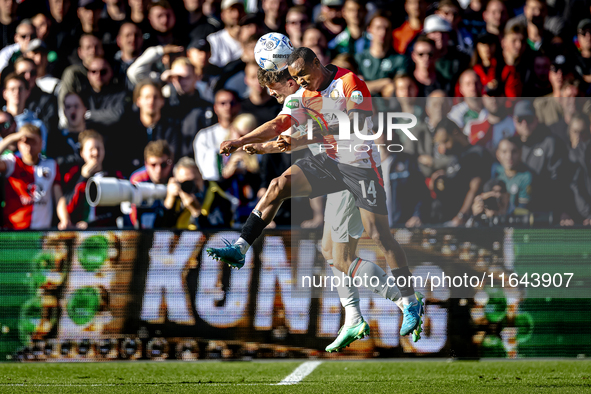 Feyenoord Rotterdam forward Igor Paixao and FC Twente defender Bas Kuipers play during the match between Feyenoord and Twente at the Feyenoo...