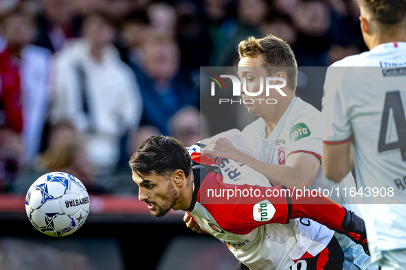 Feyenoord Rotterdam forward Santiago Gimenez and FC Twente midfielder Mathias Kjolo play during the match between Feyenoord and Twente at th...