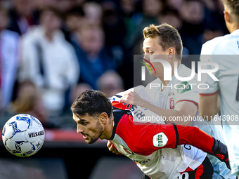 Feyenoord Rotterdam forward Santiago Gimenez and FC Twente midfielder Mathias Kjolo play during the match between Feyenoord and Twente at th...