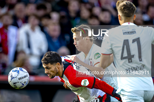 Feyenoord Rotterdam forward Santiago Gimenez and FC Twente midfielder Mathias Kjolo play during the match between Feyenoord and Twente at th...