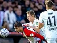 Feyenoord Rotterdam forward Santiago Gimenez and FC Twente midfielder Mathias Kjolo play during the match between Feyenoord and Twente at th...