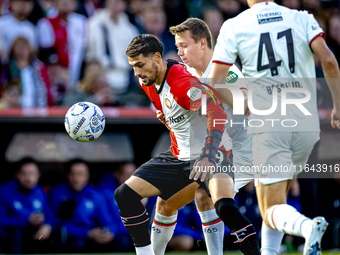 Feyenoord Rotterdam forward Santiago Gimenez and FC Twente midfielder Mathias Kjolo play during the match between Feyenoord and Twente at th...