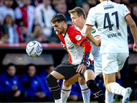 Feyenoord Rotterdam forward Santiago Gimenez and FC Twente midfielder Mathias Kjolo play during the match between Feyenoord and Twente at th...