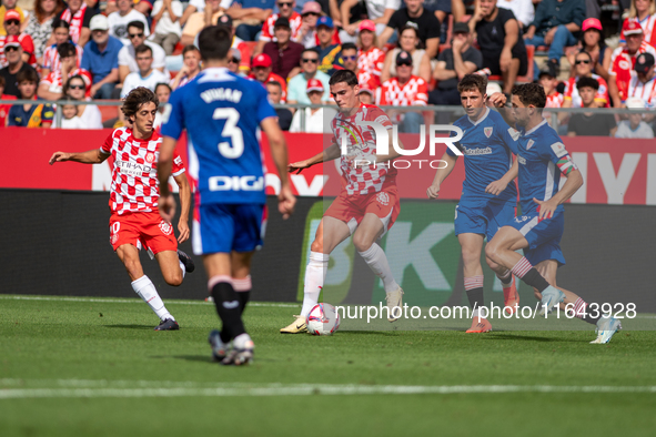 Players are in action during the LaLiga EA Sports match between Girona FC and Athletic Club de Bilbao at Montilivi Stadium in Girona, Spain,...