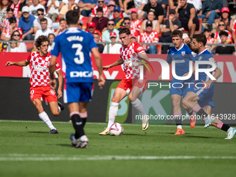 Players are in action during the LaLiga EA Sports match between Girona FC and Athletic Club de Bilbao at Montilivi Stadium in Girona, Spain,...