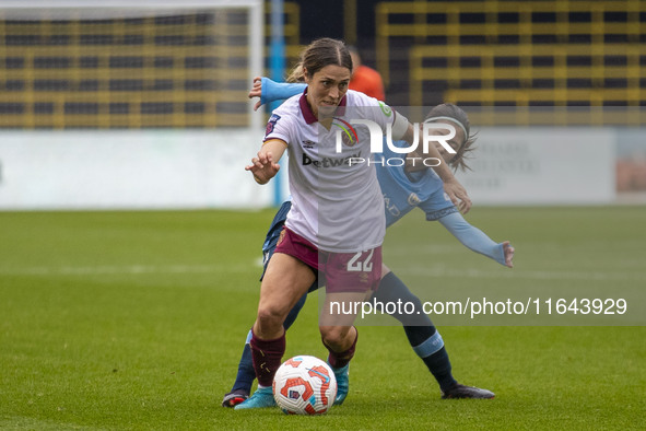 Katrina Gorry #22 of West Ham United F.C. is tackled by Yui Hasegawa #25 of Manchester City W.F.C. during the Barclays FA Women's Super Leag...