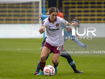 Katrina Gorry #22 of West Ham United F.C. is tackled by Yui Hasegawa #25 of Manchester City W.F.C. during the Barclays FA Women's Super Leag...