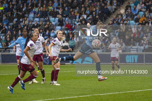 Vivianne Miedema #6 of Manchester City W.F.C. heads the ball during the Barclays FA Women's Super League match between Manchester City and W...