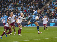 Vivianne Miedema #6 of Manchester City W.F.C. heads the ball during the Barclays FA Women's Super League match between Manchester City and W...