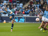 Vivianne Miedema #6 of Manchester City W.F.C. takes a shot at goal during the Barclays FA Women's Super League match between Manchester City...