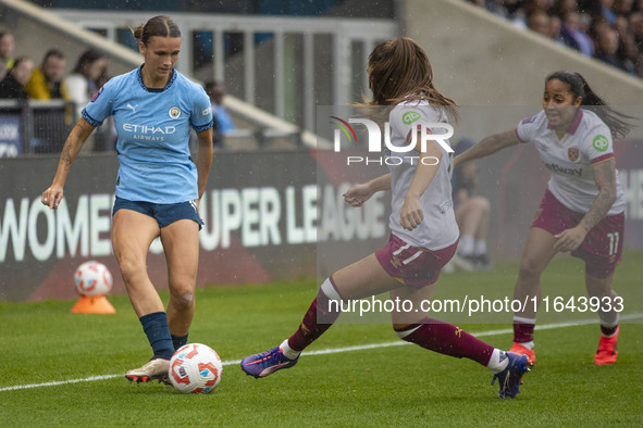 Kerstin Casparij #18 of Manchester City W.F.C. is tackled by Seraina Piubel #77 of West Ham United F.C. during the Barclays FA Women's Super...