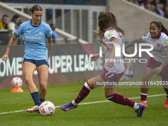 Kerstin Casparij #18 of Manchester City W.F.C. is tackled by Seraina Piubel #77 of West Ham United F.C. during the Barclays FA Women's Super...