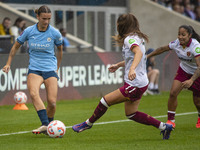 Kerstin Casparij #18 of Manchester City W.F.C. is tackled by Seraina Piubel #77 of West Ham United F.C. during the Barclays FA Women's Super...