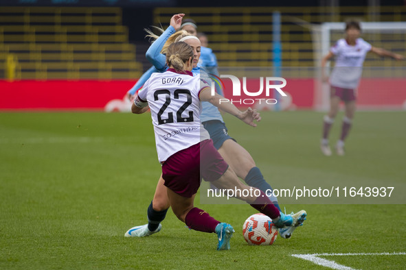 Chloe Kelly #9 of Manchester City W.F.C. tackles Katrina Gorry #22 of West Ham United F.C. during the Barclays FA Women's Super League match...