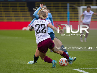 Chloe Kelly #9 of Manchester City W.F.C. tackles Katrina Gorry #22 of West Ham United F.C. during the Barclays FA Women's Super League match...