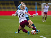 Chloe Kelly #9 of Manchester City W.F.C. tackles Katrina Gorry #22 of West Ham United F.C. during the Barclays FA Women's Super League match...