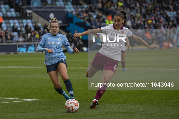 Amber Tysiak, number 5 of West Ham United F.C., clears the area during the Barclays FA Women's Super League match between Manchester City an...