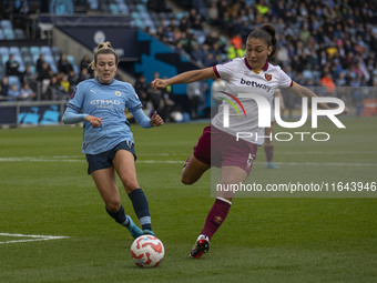 Amber Tysiak, number 5 of West Ham United F.C., clears the area during the Barclays FA Women's Super League match between Manchester City an...