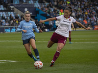 Amber Tysiak, number 5 of West Ham United F.C., clears the area during the Barclays FA Women's Super League match between Manchester City an...