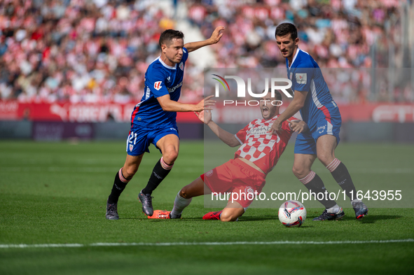 Players are in action during the LaLiga EA Sports match between Girona FC and Athletic Club de Bilbao at Montilivi Stadium in Girona, Spain,...